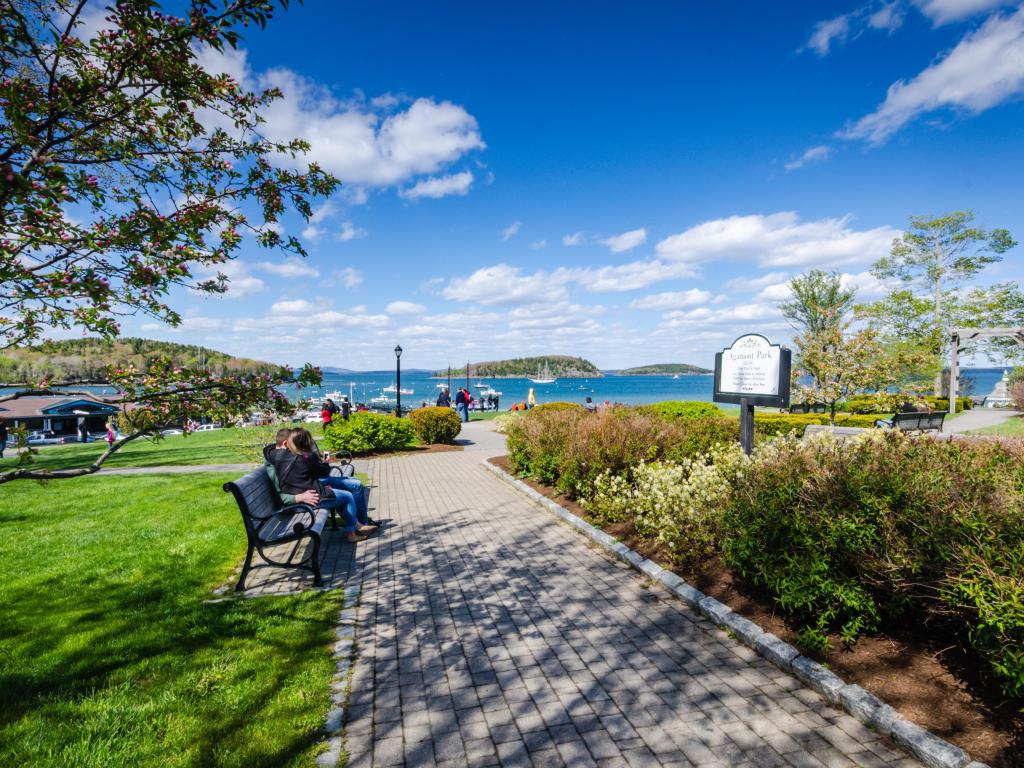 Agamont Park in Bar Harbor, Maine with people sitting on a park bench