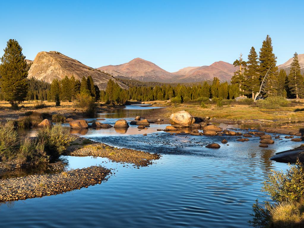 Tuolumne Meadows are a tranquil place to hike along the river with Yosemite sights in all directions.