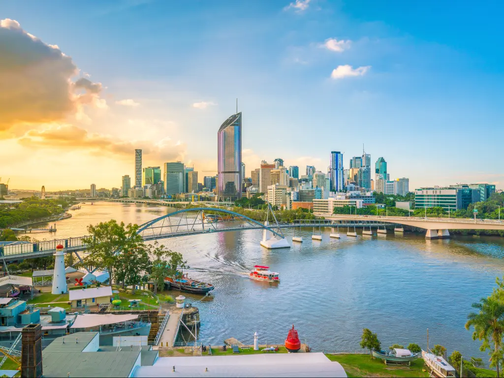 Skyline of Brisbane, Queensland, Australia in the afternoon with the Brisbane River in the foreground.