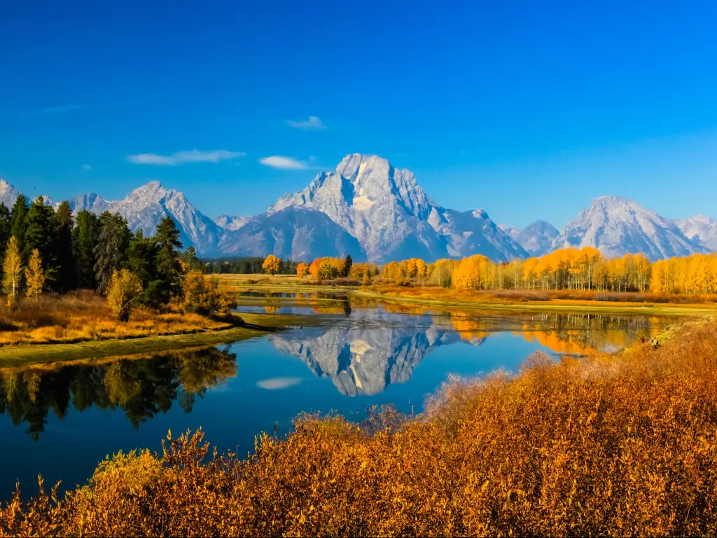 Amazing mountains in Grand Teton National Park with the mountains reflecting on a lake.