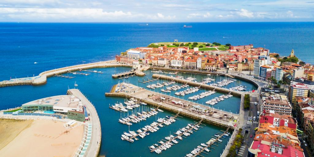 An aerial view of Gijon harbour on a sunny day