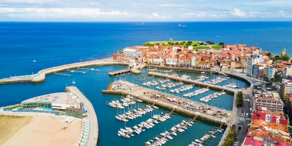 An aerial view of Gijon harbour on a sunny day