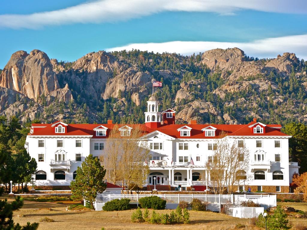 The famous Stanley Hotel of the Shining fame on a bright, but partially cloudy day.