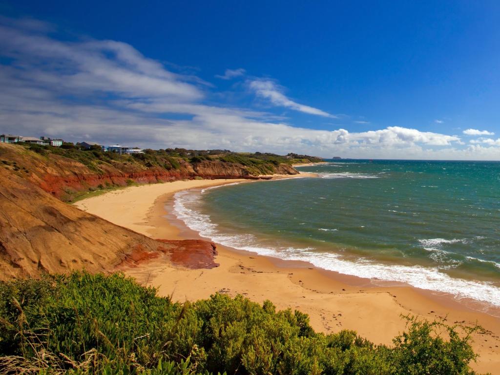 Sandy bay with waves breaking