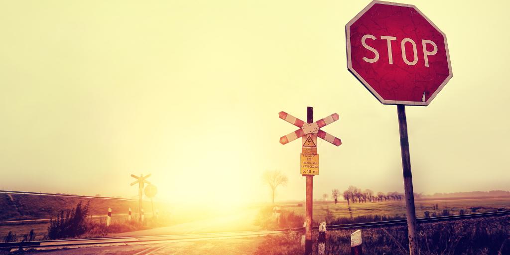 A stop sign in the middle of nowhere at dusk 