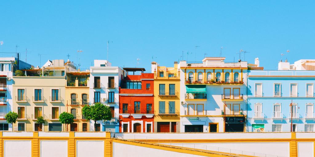 Colourful houses line the waterfront in Seville's Triana neighbourhood, on the left side of Guadalquivir river