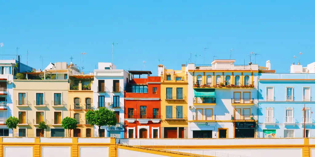 Colourful houses line the waterfront in Seville's Triana neighbourhood, on the left side of Guadalquivir river