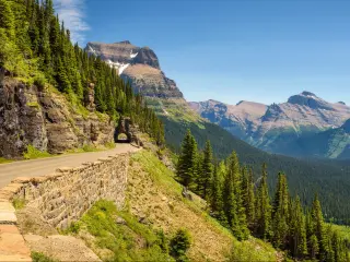 Going to the Sun Road, Montana, USA with a beautiful panoramic view of Logan Pass in Glacier National Park on a sunny day.