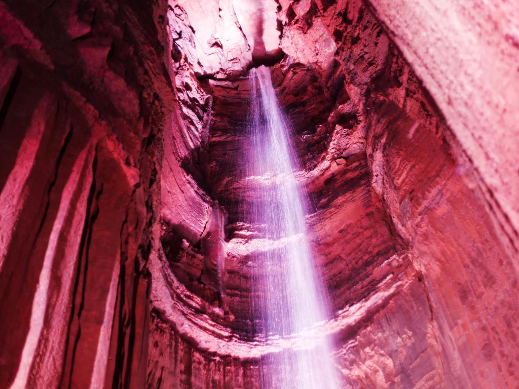 The Ruby Falls, Chattanooga, Tennessee, USA, an underground falls in the caverns of Lookout Mountain lit up in reds and pinks.