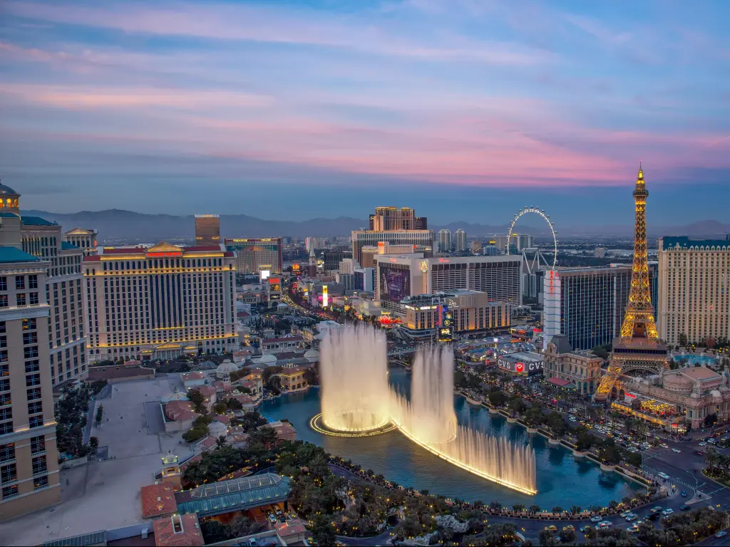 Las Vegas, Nevada, USA with an illuminated view Bellagio Hotel fountains and Las Vegas strip at sunset.