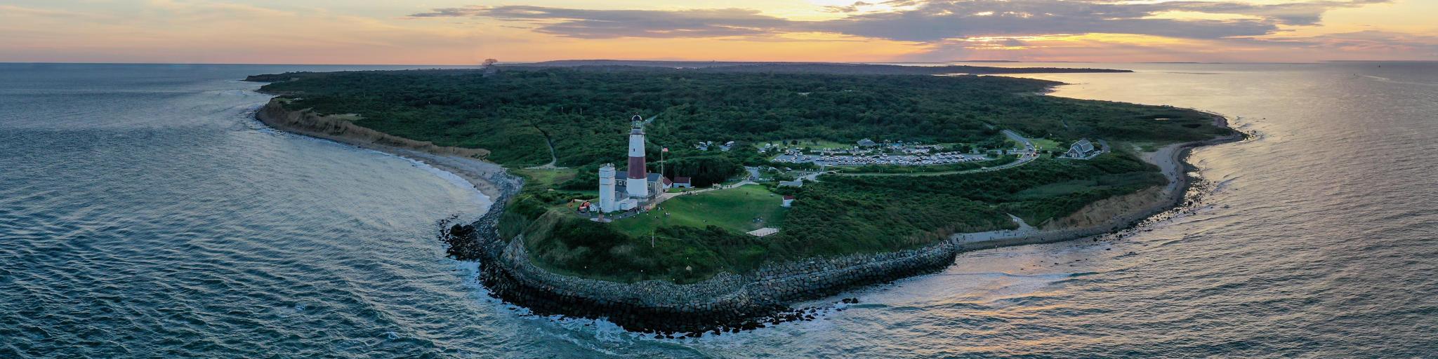An aerial shot of the Montauk Lighthouse during a sunset