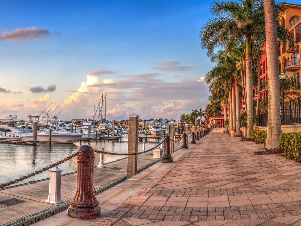 Sunset over the boats in Esplanade Harbor Marina in Marco Island, Florida