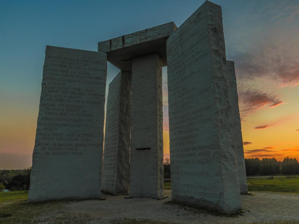 The Georgia Guidestones with 10 principles inscribed in 12 different languages at sunset