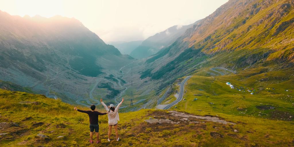 A couple enjoying views of the Transfagarasan, Romania 