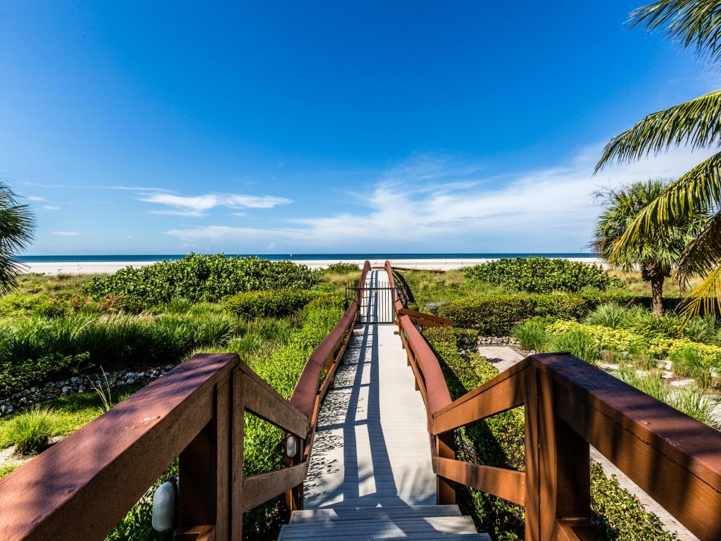 Board Walk Marco Island, Florida, USA on a sunny day with the beach in the distance.