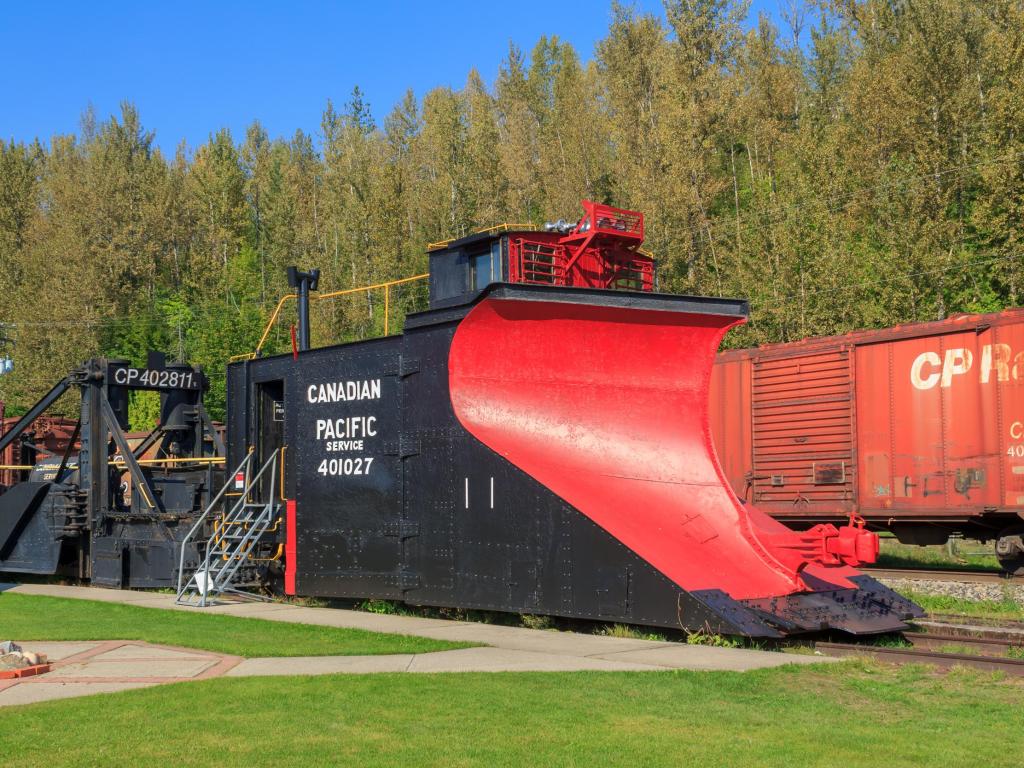 A red and black historic locomotive parked up at Revelstoke Railway Museum, with Canadian Pacific Service written on the side