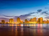 New Orleans, Louisiana, USA with the city skyline on the Mississippi River at night. 