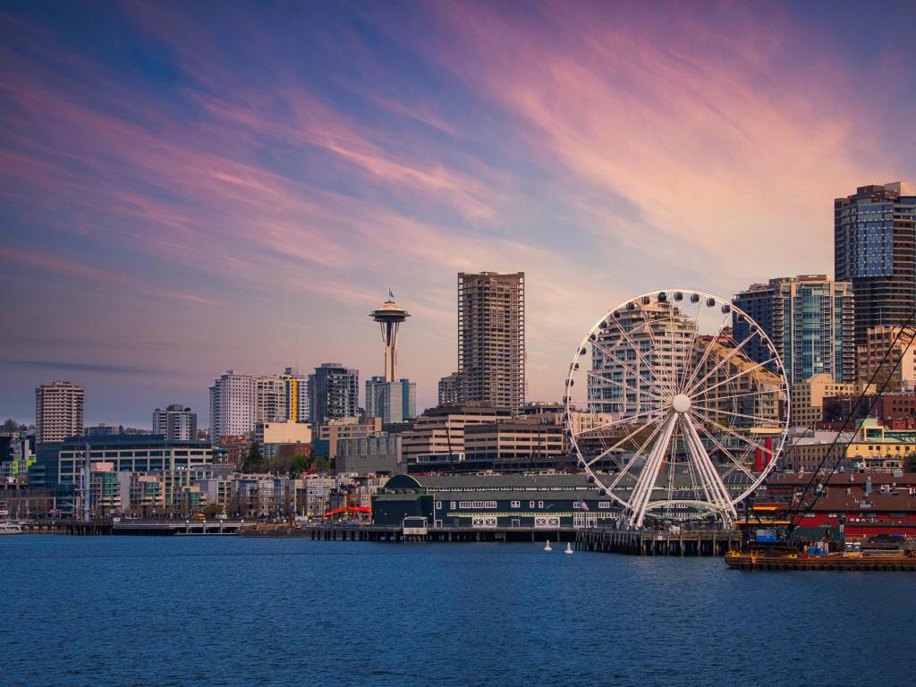 Seattle, USA with downtown city skyline and the Great Wheel at the water front taken at dawn. 