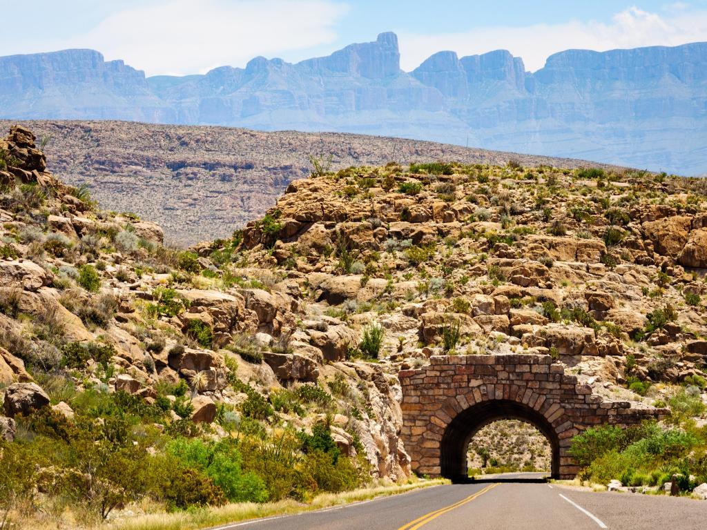 Bricked tunnel underneath mountains along a stretch of road at Big Bend National Park