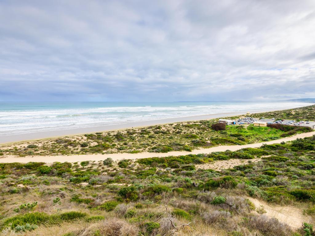 Goolwa, South Australia with a view of the beach and sand dunes and sea in the distance.