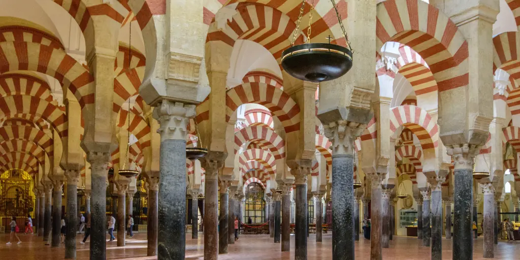Moorish-inspired archways inside the Mezquita Cathedral in Cordoba, Spain