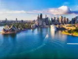 Major architecture landmarks of the city of Sydney and Australia around Sydney harbour in elevated aerial view in warm smooth sunlight at the morning.