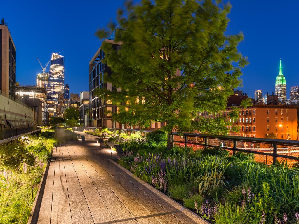 The High Line, New York, with city lights and skyscrapers in the background