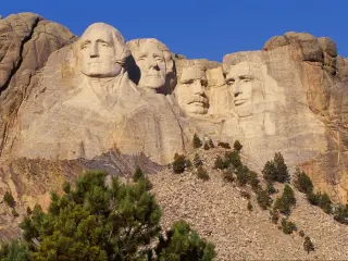 Mount Rushmore mountain with US Presidents carved into the rock.