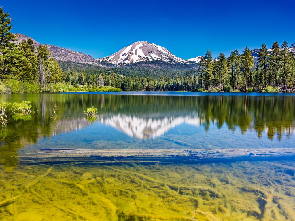 Lassen Peak and its reflection in Manzanita Lake in the Lassen Volcanic National Park, California