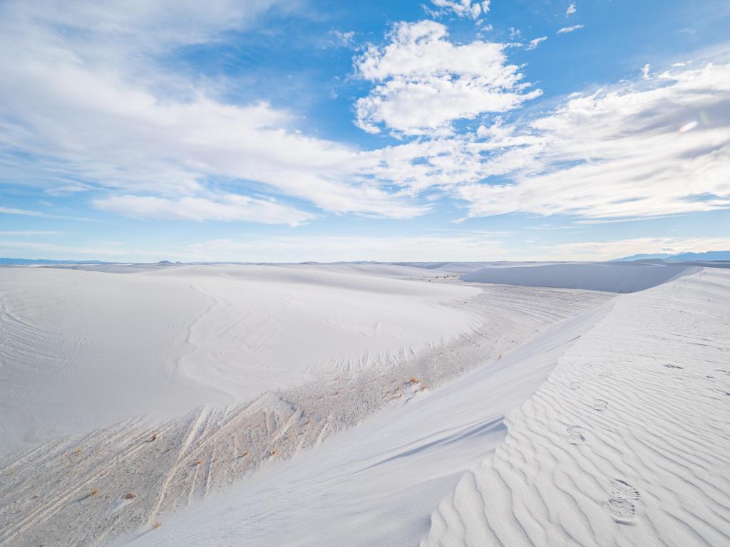 White Sands National Park, New Mexico, USA with white sand against a blue sky.