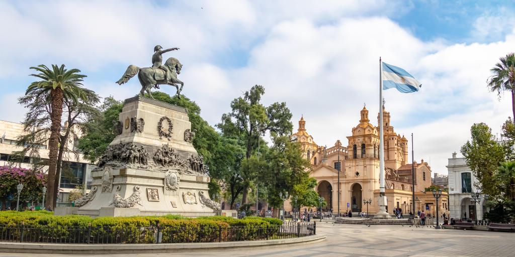 A view of San Martin Square with Cordoba Cathedral and a statue of a man on a horse in the middle
