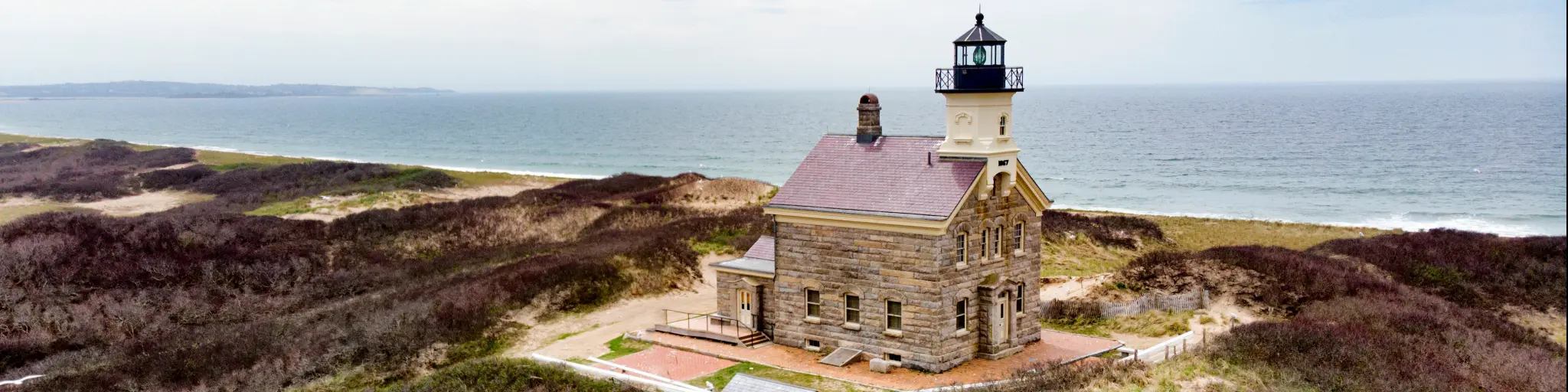 Classic lighthouse building looking out to sea on Block Island, Rhode Island.