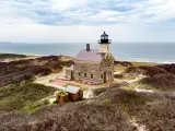Classic lighthouse building looking out to sea on Block Island, Rhode Island.