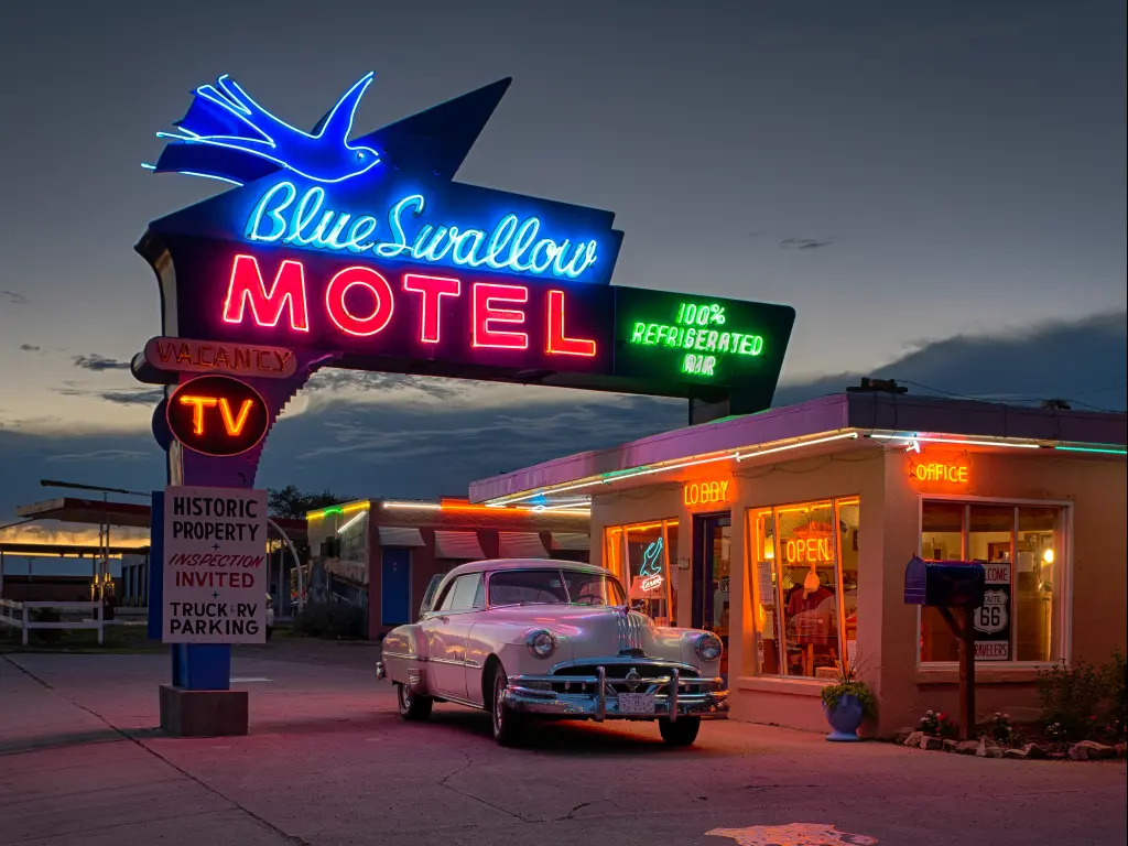 Classic car outside the historic Blue Swallow Motel on Tucumcari Boulevard, part of Route 66 in Tucumcari, New Mexico