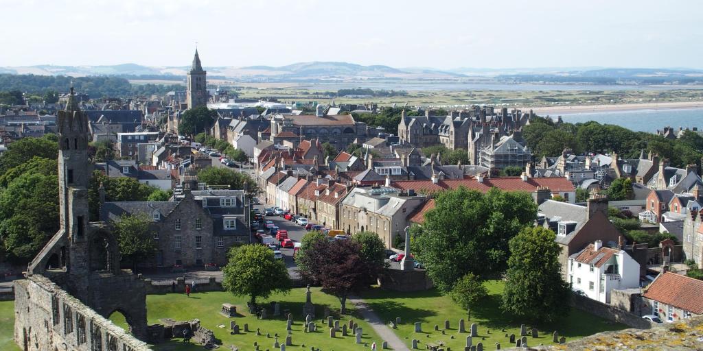 Aerial view of the city of St Andrews in Scotland, with the ruins of the gothic cathedral in the foreground