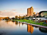 Adelaide skyline showing the river and buildings, with the reflection of the buildings in the river