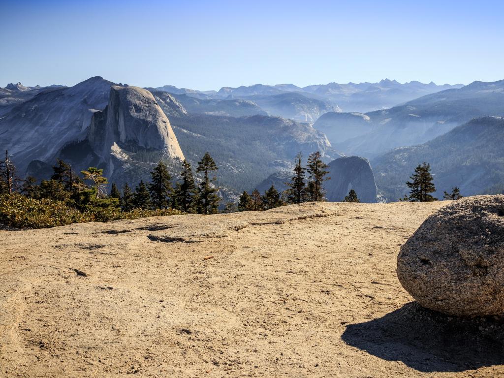 View from Sentinel Dome towards Half Dome on a sunny day