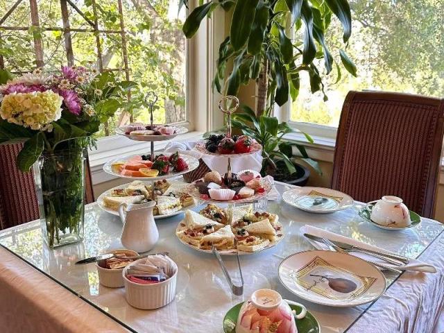 View of traditional afternoon tea at Arroyo Vista Inn, with garden views 