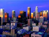 A beautiful view of the skyline with the light from the sunrise reflecting the buildings of Los Angeles