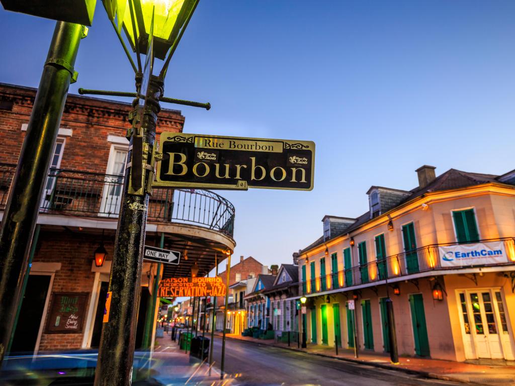 New Orleans, Louisiana, USA with a view of pubs and bars with neon lights in the French Quarter at early evening. 