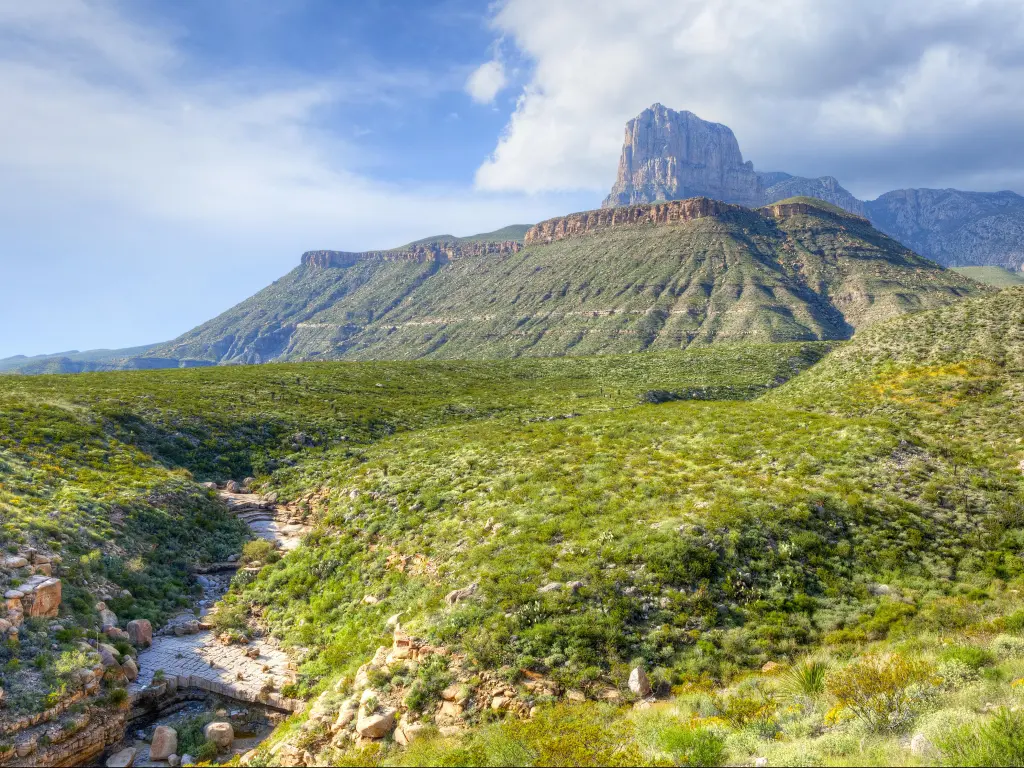 El Capitan, under storm clouds, in Guadalupe Mountains National Park, Texas, USA with a stream in the foreground.