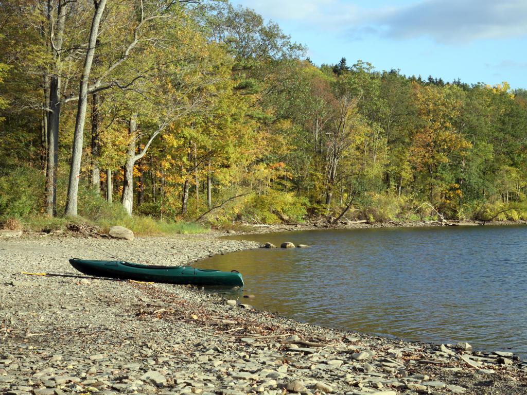 Autumn view of kayak on the shore of Canadice Lake, New York