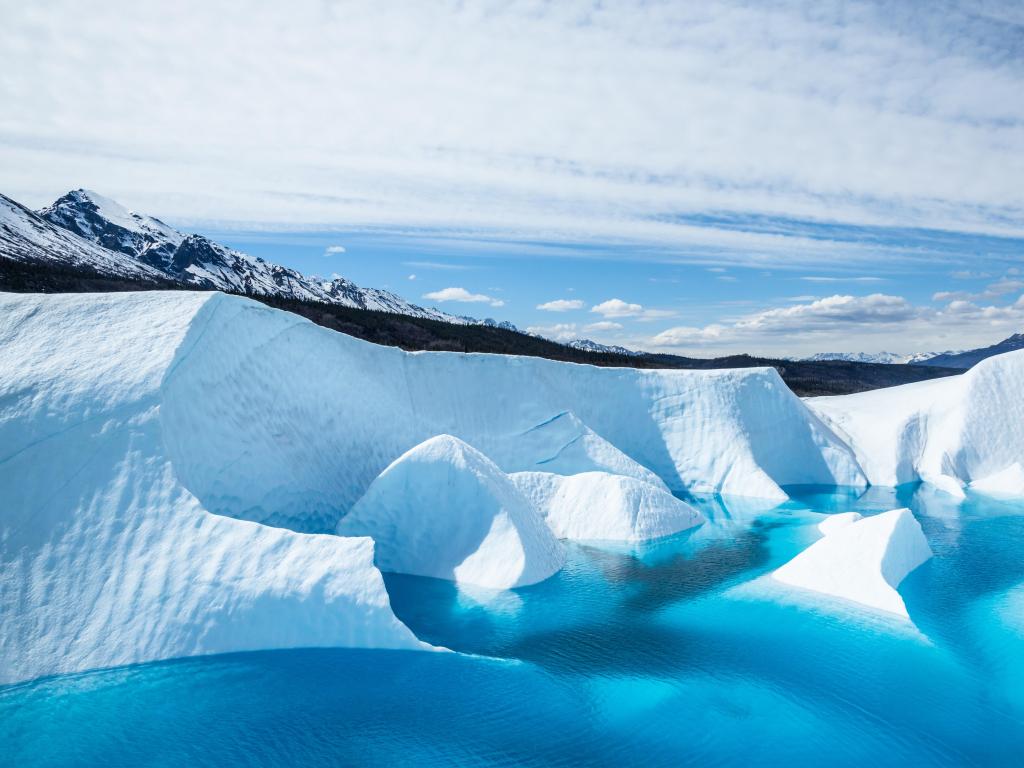 Matanuska Glacier, Alaska, USA showing the lake sitting on top of the Matanuska Glacier in south central Alaska. The ater is a deep crystal blue from minerals of the melting ice.