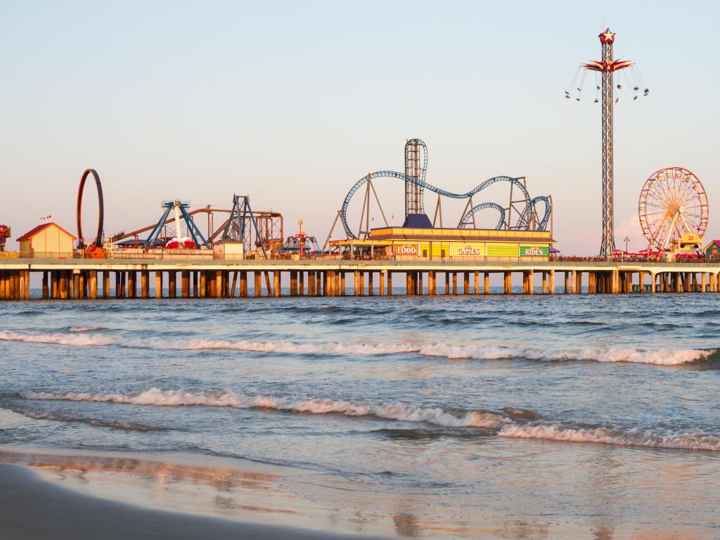 Galveston Beach in Houston during sunset, with the boardwalk on focus