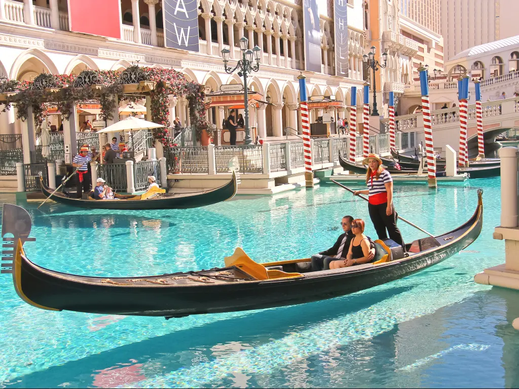 Tourists enjoying a real experience of Gondola ride in at the Grand Canal in Venetian Hotel Las Vegas