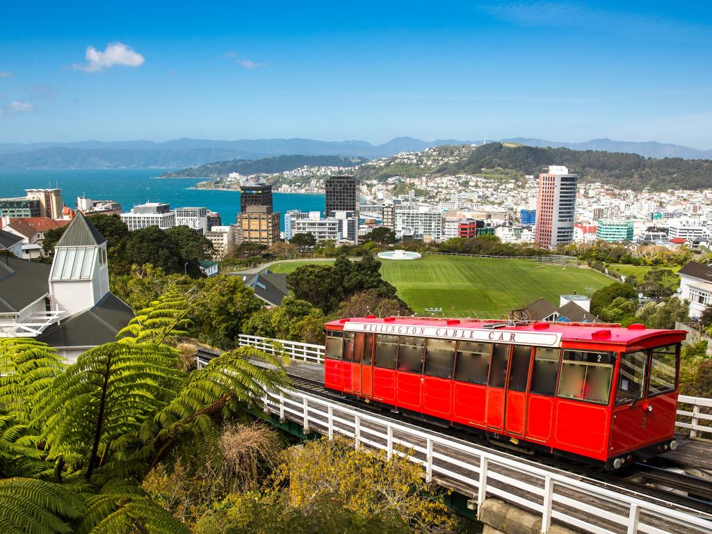 Wellington, New Zealand with a view of the Wellington Cable Car and the city in the background and sea.