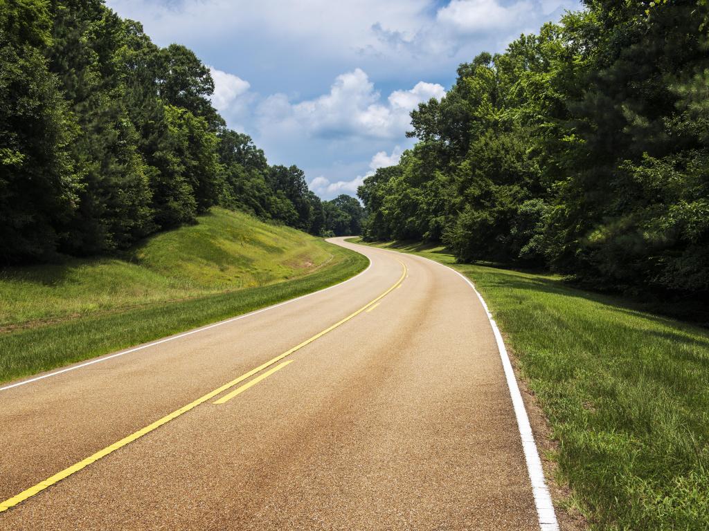 The historic Natchez Trace Parkway winding through the trees in Mississippi