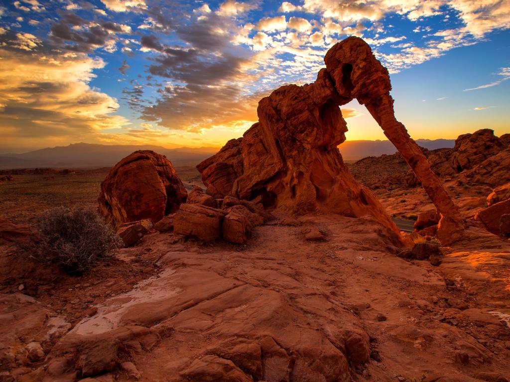 Elephant Rock in Valley of Fire State Park, USA taken at sunset with a stunning sky behind the elephant shaped rock formation in the foreground.