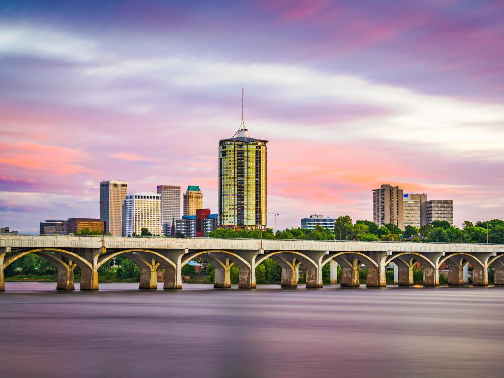 Tulsa, Oklahoma, USA downtown skyline on the Arkansas River at dusk.