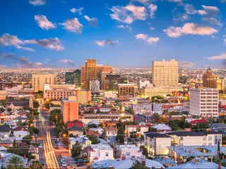 El Paso, Texas, USA downtown city skyline at dusk with Juarez, Mexico in the distance.